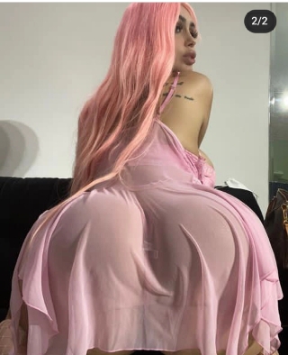 Adriana Alencar displays her Coco-Cola shape and big boobs in a pink sexy dress, as she poses in new snaps