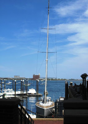 Tall masted boat moored in the harbour