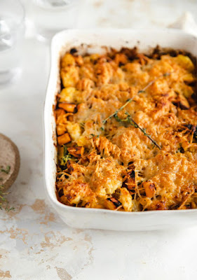 baked pumpkin casserole in white casserole dish