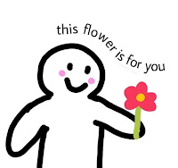 Es un dibujo de una persona sonriendo sosteniendo una flor con pétalos rojos. Arriba está escrita en inglés la frase "esta flor es para ti".