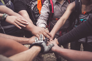 A look at creating student groups.  Hands together to form a group.