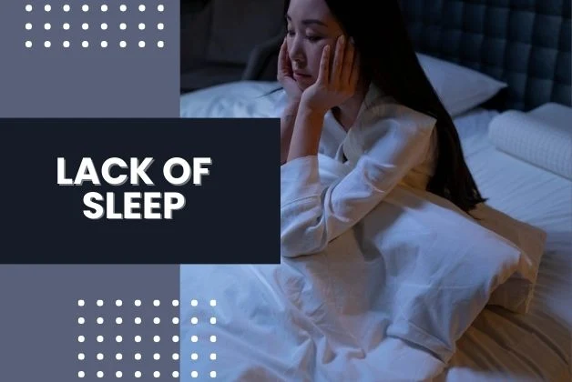 A woman experiencing sleeplessness in bed at night, symbolizing the "Lack of Sleep" as a potential cause of brain fog.