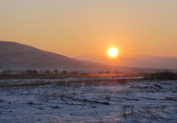 Cold winter sun at hills