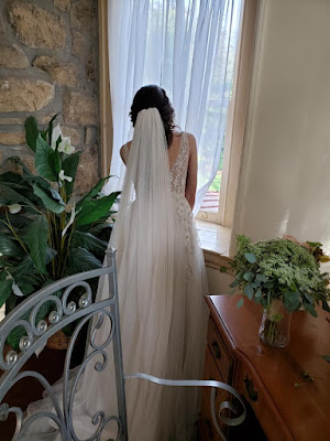 bride watching guests arrive