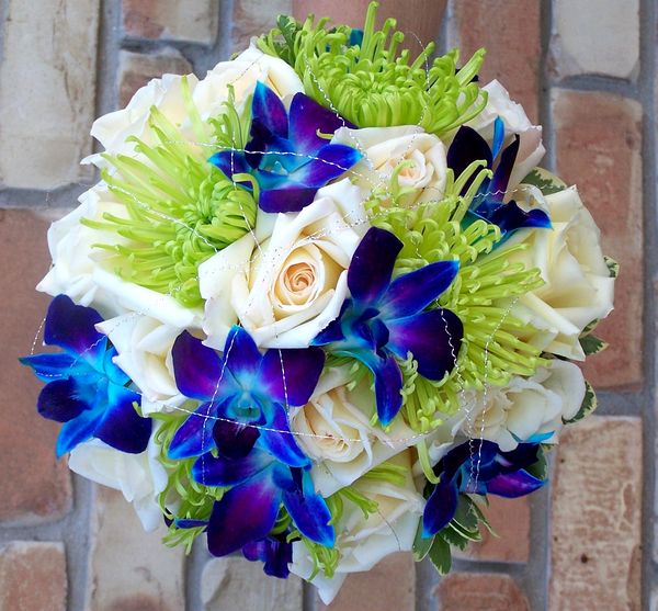 Bouquet of blue orchids and green Spider Mums
