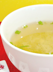 bowl of vegetarian egg drop soup and scallions chopped up