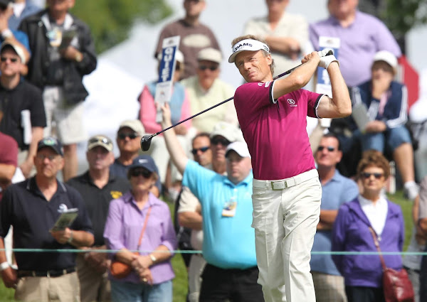 Golfer Bernhard Langer plays a shot