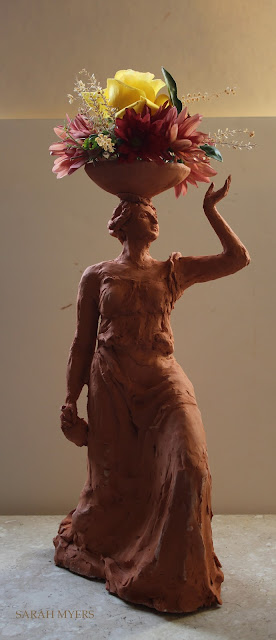 woman, sculpture, bowl, figure, terracotta, ceramic, earthenware, red, Sarah, Myers, flowers, lady, escultura, art, arte, clay, bottle, bouquet, rose, chrysanthemums, mums, yellow, orange, new, artwork, classic, figurative, renaissance, artist, tall, beautiful, spontaneous, kunst, move, walk, stride, arrangement, decor, deco