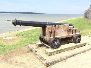 Historic Jamestown Canon pointed out to the water 