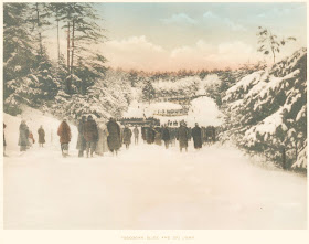 A group of people on a ski hill.