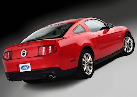 Rear 3/4 view of red 2011 Ford Mustang GT