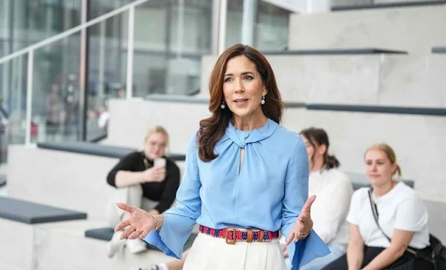 Crown Princess Mary wore a flare sleeve knot blouse by Victoria Beckham, and an ivory silk skirt by Birger et Mikkelsen