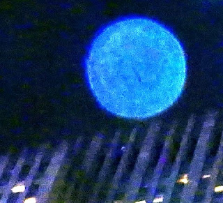 blue orb in sky