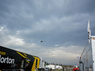 CHOPPER FLYING OVER RACES