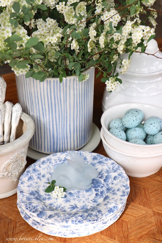 A fast and easy blue and white Easter tablescape started with bridal wreath spirea branches from the yar