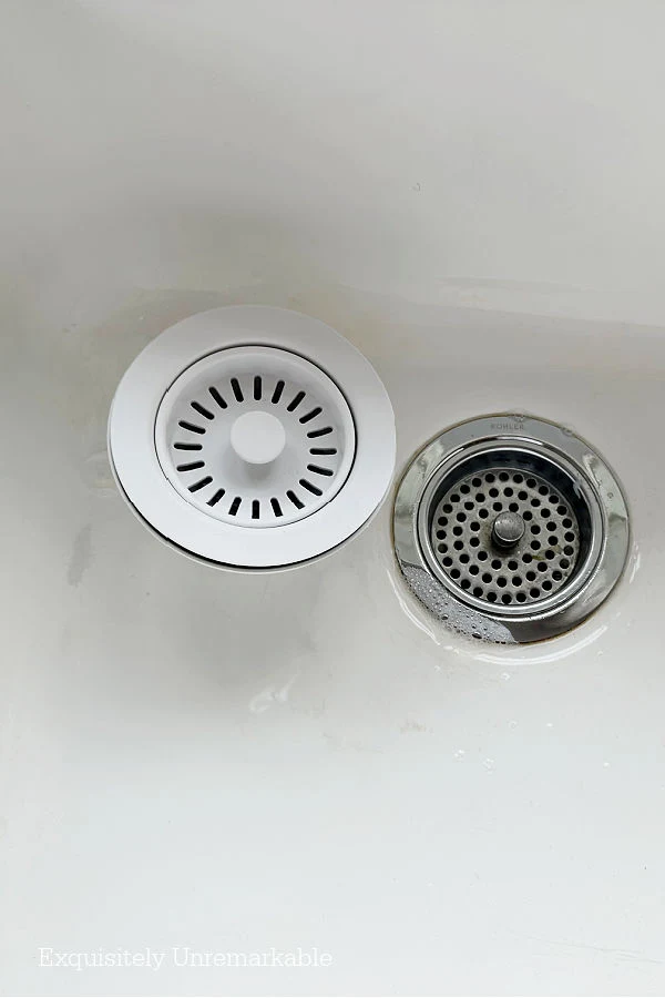 Stainless Steel And White Kitchen Sink Strainers in a white porcelain sink