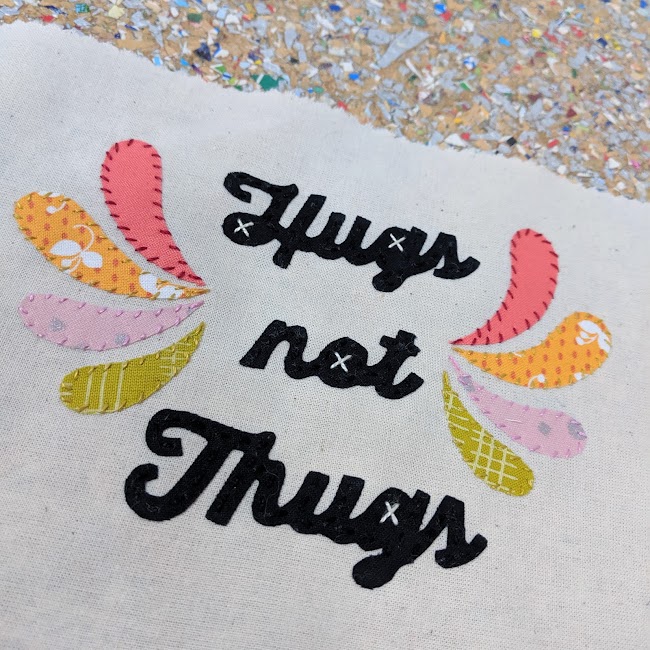 hugs not thugs mini banner