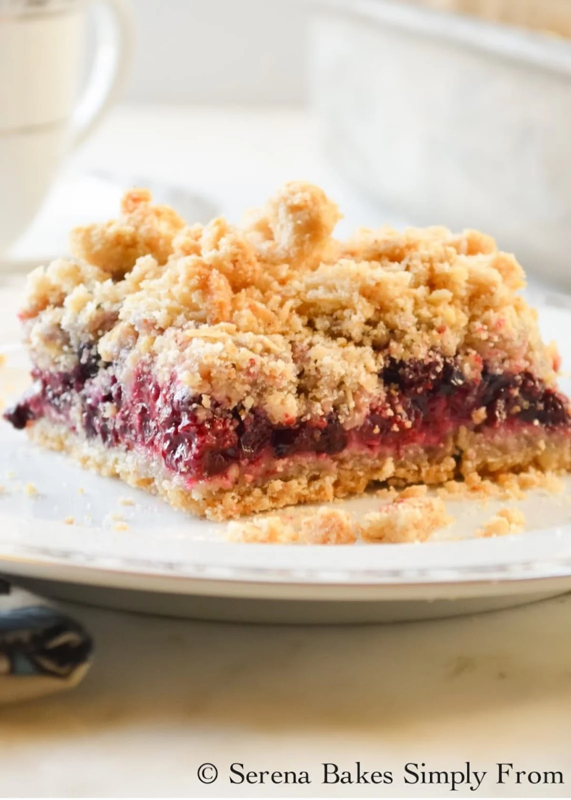 Blackberry Crumb Bars on a white plate.