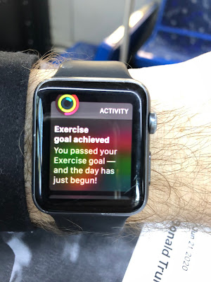 Apple Watch. Reads, "Exercise goal achieved - You passed your Exercisse goal --and the day has just begun!"