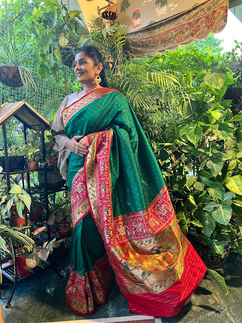 Green and red Banarasi Silk saree with elephants border and pallu