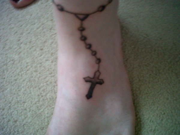 Emma has the rosary bead anklet tattoo similar to Nicole's
