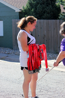 Jessica Beecham ready to receive racers with their medals at finish