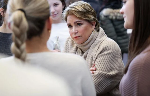 Grand Duchess Maria Teresa wore a wool and cashmere cardigan and sleeveless sweater by Barbara Bui. Joseph Ade midi skirt