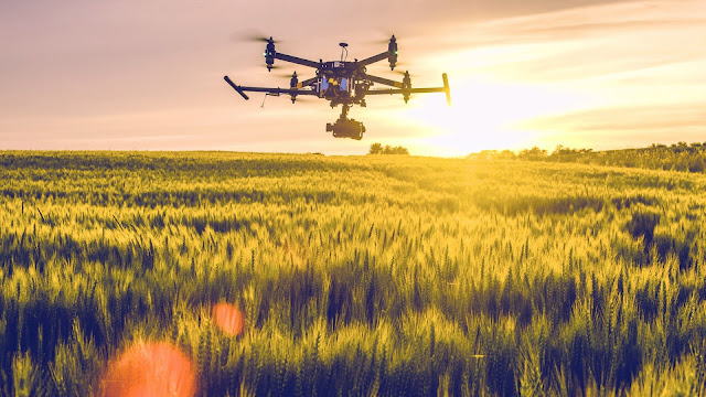 Three projects that BT has involved in have received funding and support from UKRI Drone flying over field at sunset