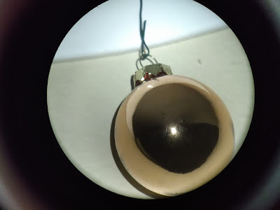 star-like point reflected in Xmas ball without mask