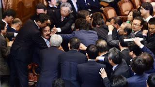 Japan security debate marred by scuffles in upper house