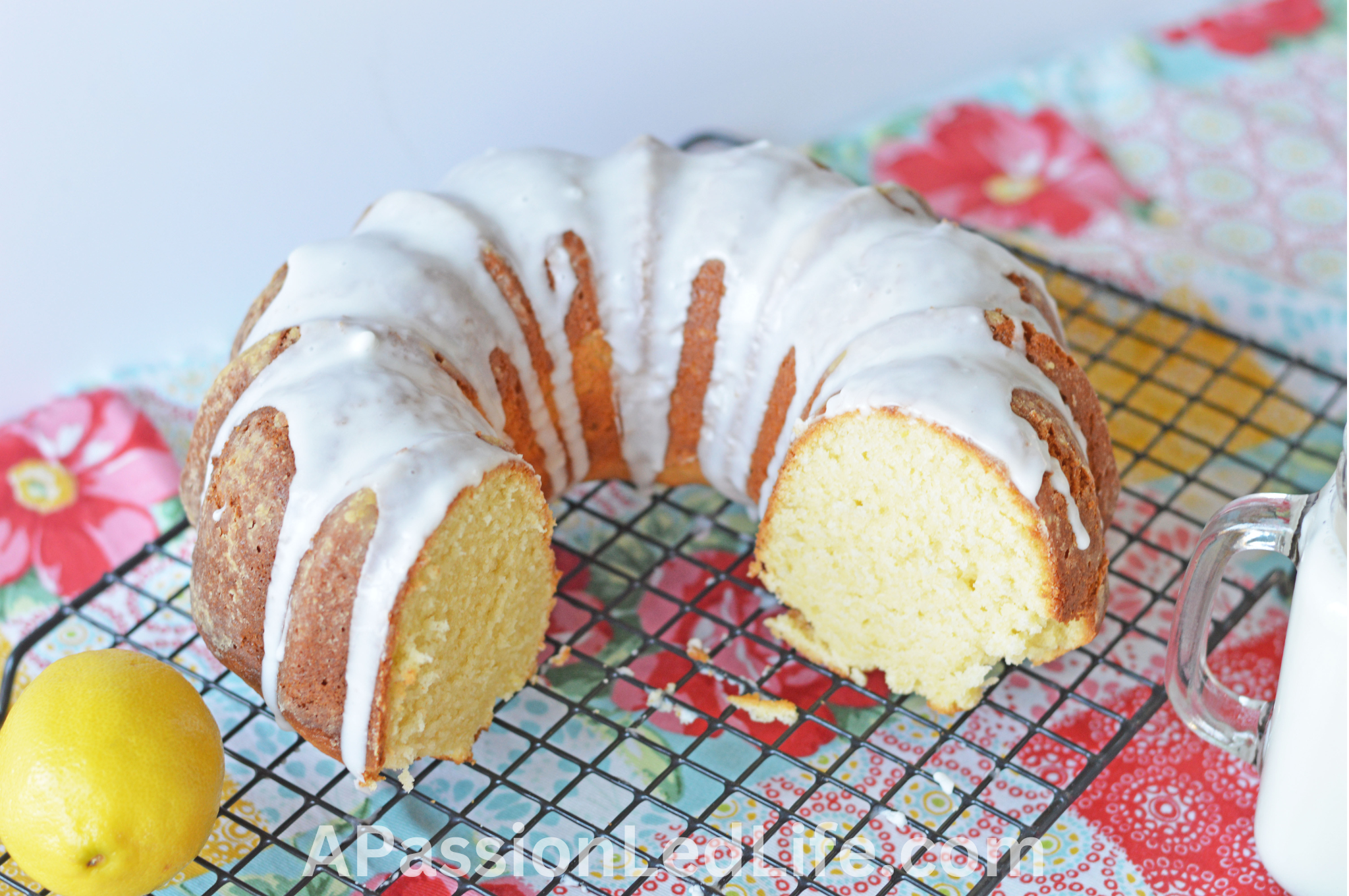 bundt cake with icing on a cooling rack