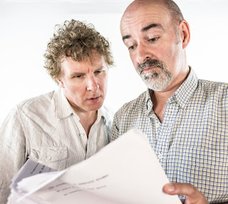 Richard Earl and Nicholas Briggs looking at a script