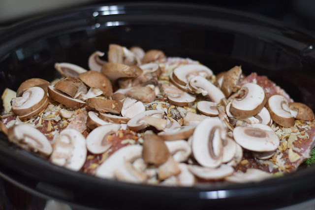 Add the sliced mushrooms over the top of everything in the slow cooker. 