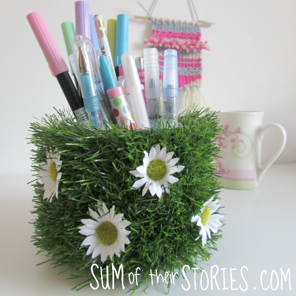 Coffee tub upcycled into a daisy pen pot