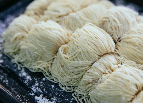 There are only a few ingredients needed to make pasta - flour, water, and salt. That's it! With just these basic ingredients, you can make all sorts of pasta shapes and sizes.