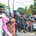 SuperHero: Amosun Fights Angry Mob at Adeleke's Burial, Saves Female Politician From Lynch [PHOTOS]