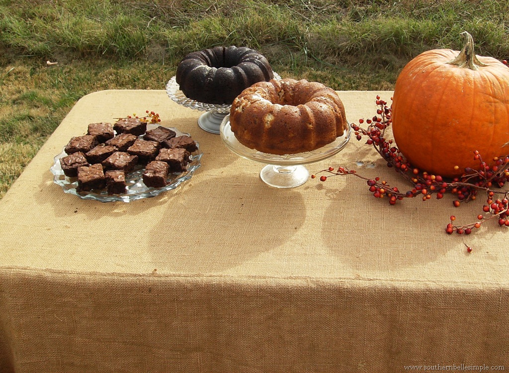 A burlap table cloth pumpkins and other natural elements really created the