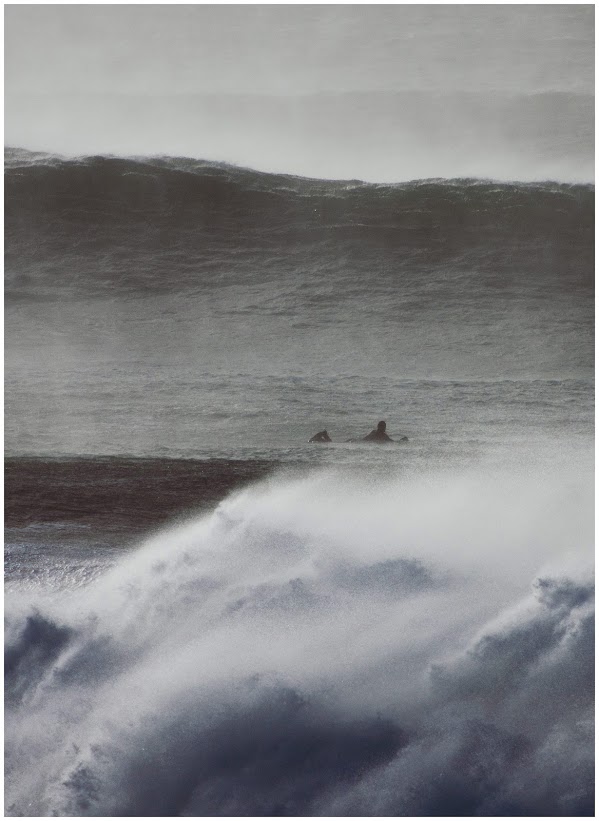 Lone surfer out in big waves at Fistral Beach, Newquay, Cornwall.