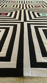 Black and white modern log cabin quilt in Curated Quilts