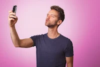 Man looking at him with a funny look on his face