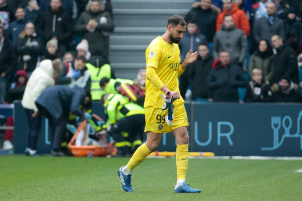 PSG goalkeeper Gianluigi Donnarumma leaves the pitch after receiving a red card while on the left Fabian Ruiz Pena of PSG leaves the pitch on a stretcher with an injury during the Ligue 1 Uber Eats match between Le Havre AC (HAC) and Paris Saint-Germain (PSG) at Stade Oceane on December 3, 2023 in Le Havre, France.