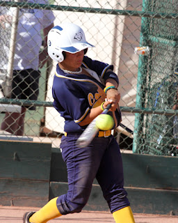 Bree Bitton makes contact on a hit.