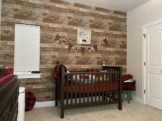 Cabin Nursery Theme with Do Not Wake the Bear sign above crib