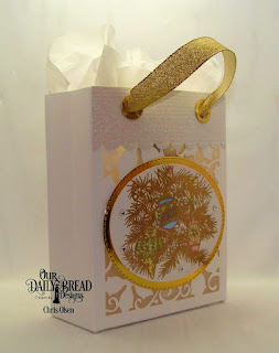 Our Daily Bread Designs, Card Caddy and Gift Bag Die,  Double Stitched Oval dies,  Oval Stitched Rows Dies, Poinsettia Inset Dies,  Gift Bag Handles and Toppers Die and Noel Ornaments stamp set.  