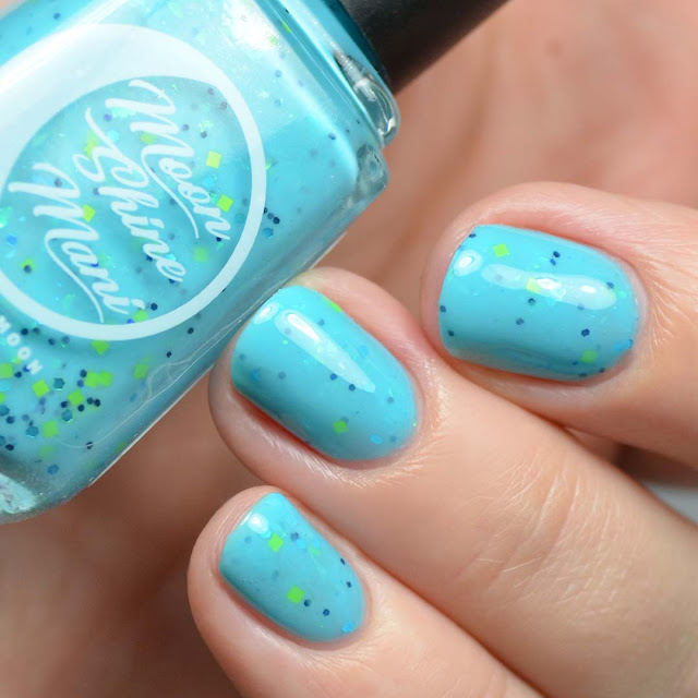 blue crelly nail polish with green glitter