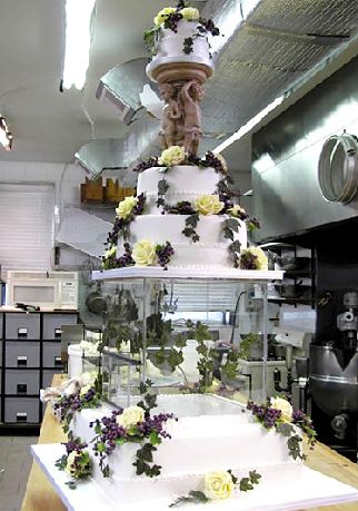 A vintage wedding cake Do you see the transparent cage near the bottom of