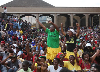 Zimbabwean president's supporters march across center of capital