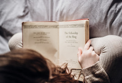 Child reading on the bed