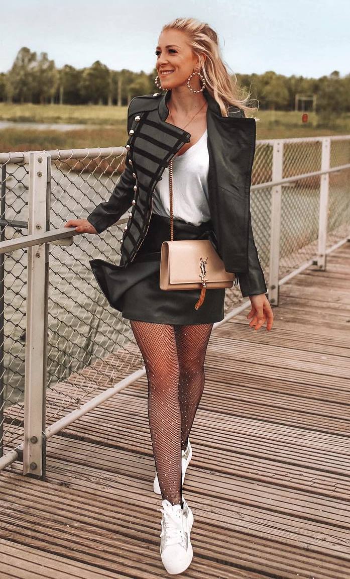 how to wear a leather skirt : white top + crossbody bag + sneakers