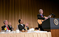 President George W. Bush and Representative Emanuel Cleaver, R-Mo., listen to Dr. Francis Collins during the National Prayer Breakfast in Washington, D.C., Thursday, Feb. 1, 2007. Dr. Collins is the director of the National Human Genome Research Institute. White House photo by Eric Draper.